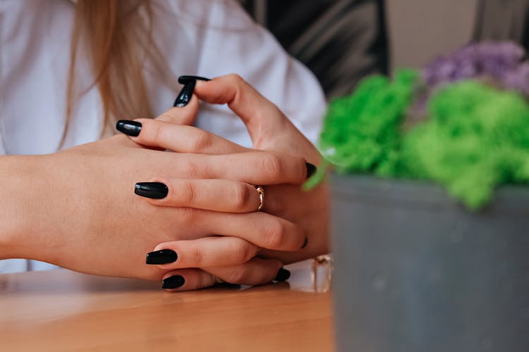 Close-up Shot Of A Black Nails