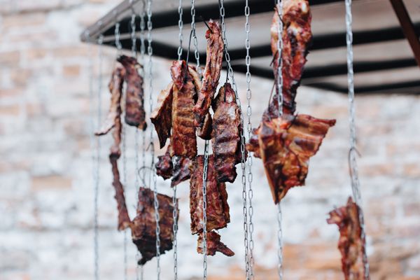 Strips of dried, cured meat hanging to preserve