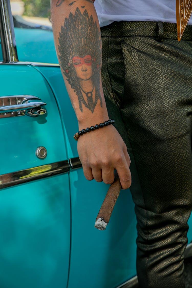 A Person Smoking A Cigar 