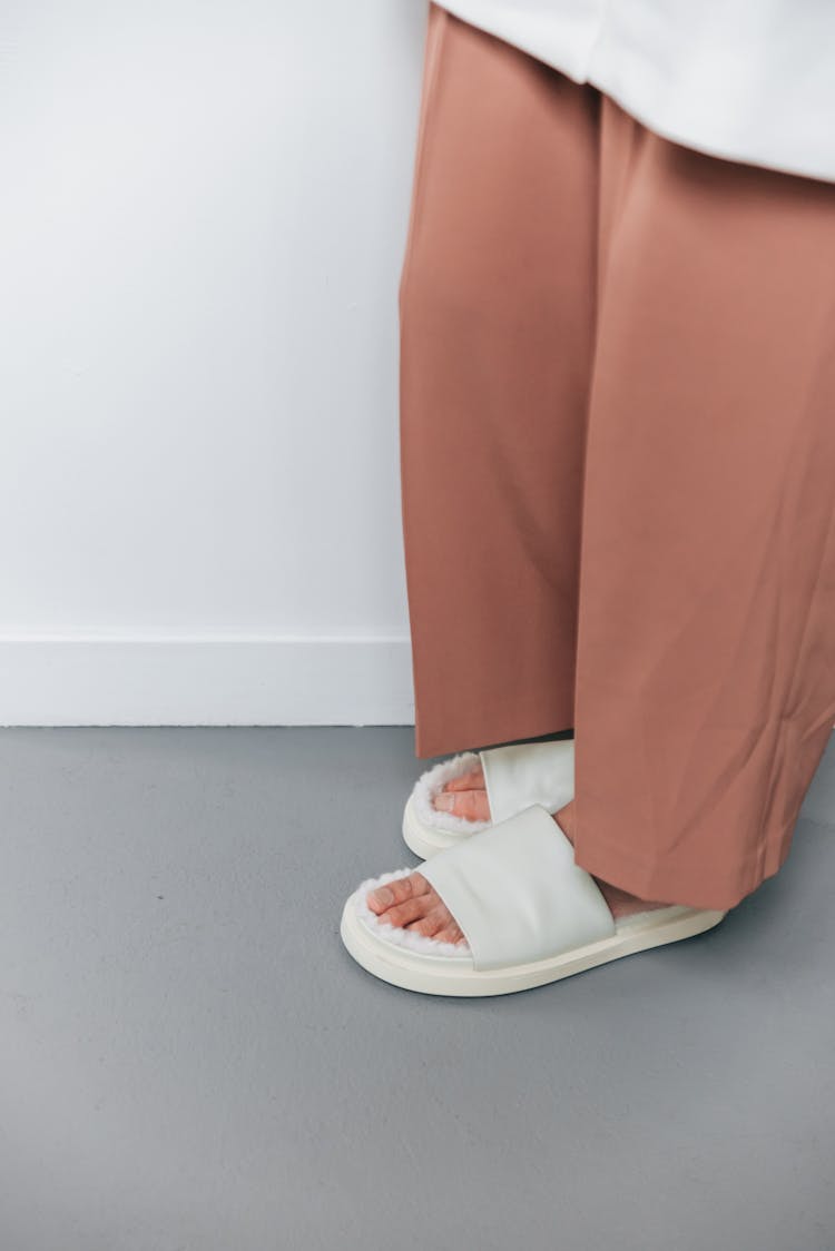 Person Wearing White Slides Slippers 