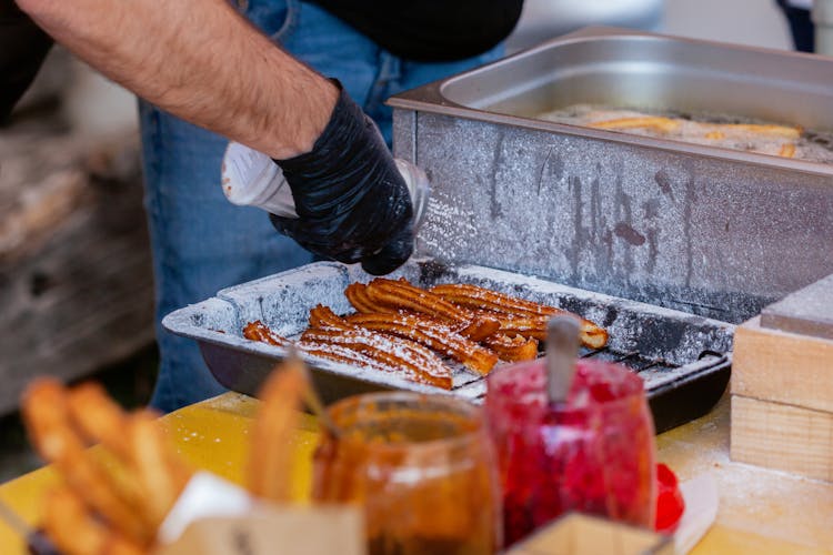 Fried Churros In A Black Tray