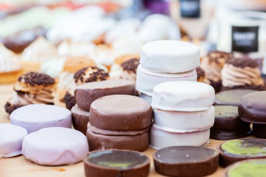 A delightful assortment of colorful iced cookies and pastries, perfect for any sweet tooth.