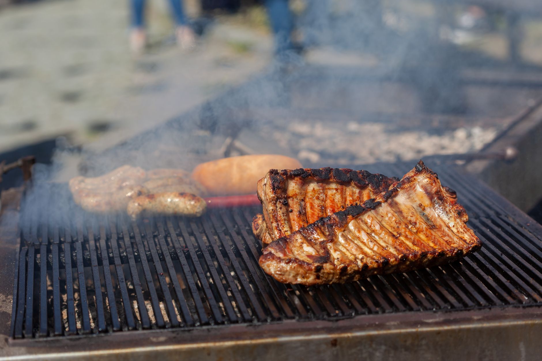 Goat ribs grilling over charcoal at a Nairobi nyama choma joint