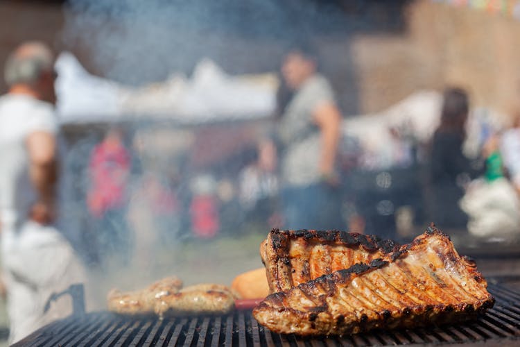 Photograph Of Ribs Being Grilled