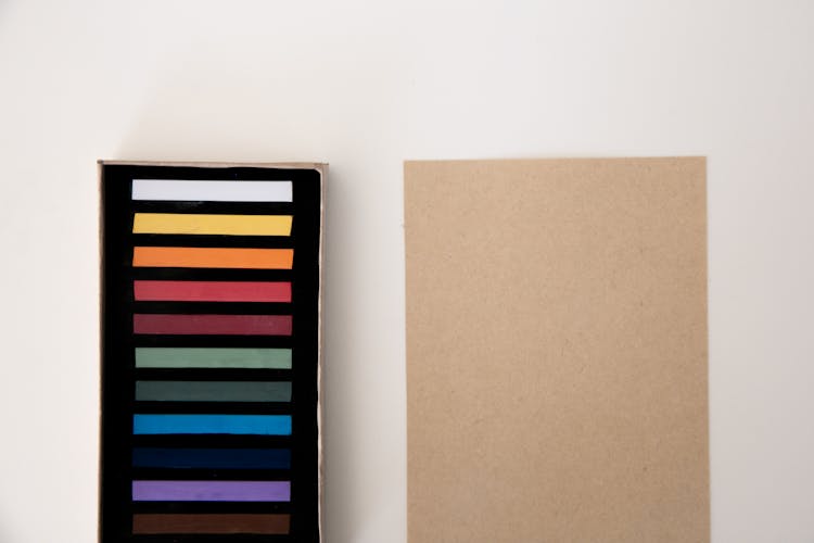 Photograph Of Strips Of Colors On A Black Surface