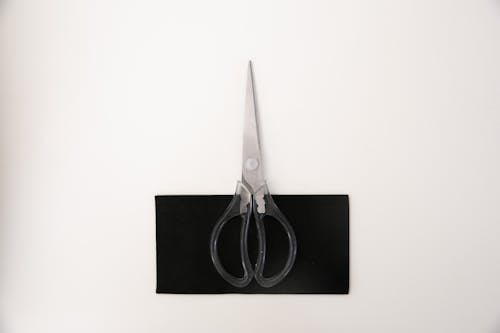 Black and Silver Scissors White Surface 