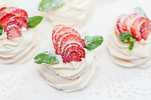 A Meringue with Strawberry and Mint Leaves Toppings