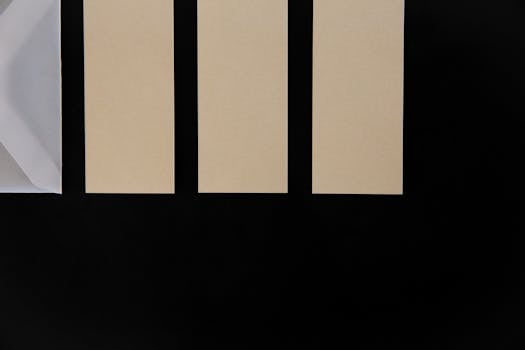 Abstract minimalist composition featuring beige rectangles on a black background.