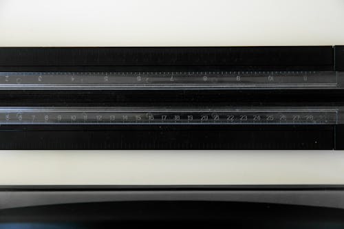 A Ruler on a Black Surface