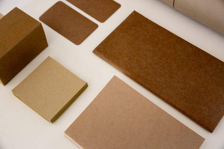 Kraft Papers On White Surface 