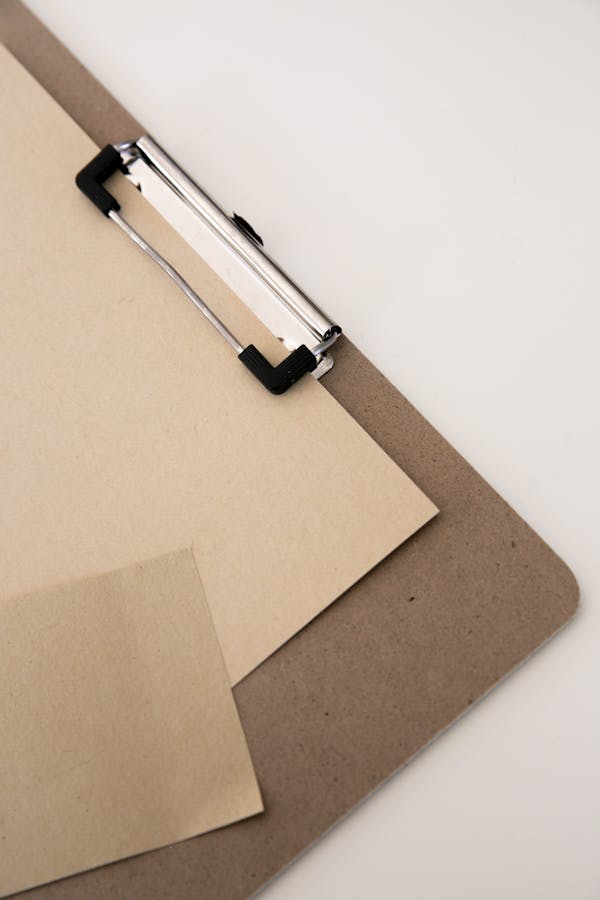 Brown Clipboard with Brown Sheet of Paper