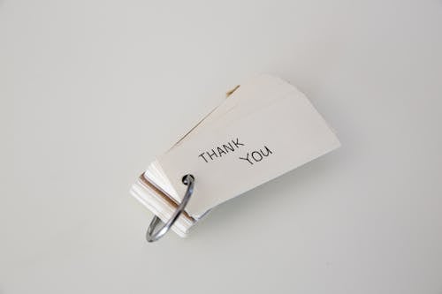 Free Thank You Text on a Paper Strip Stock Photo