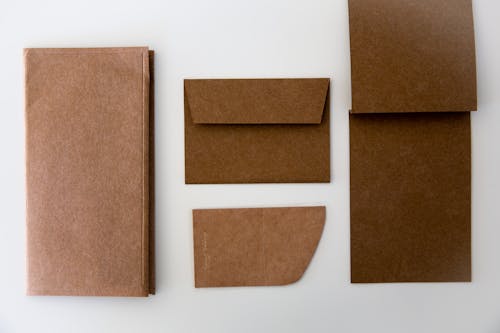 Free Cardboard Papers on White Surface  Stock Photo