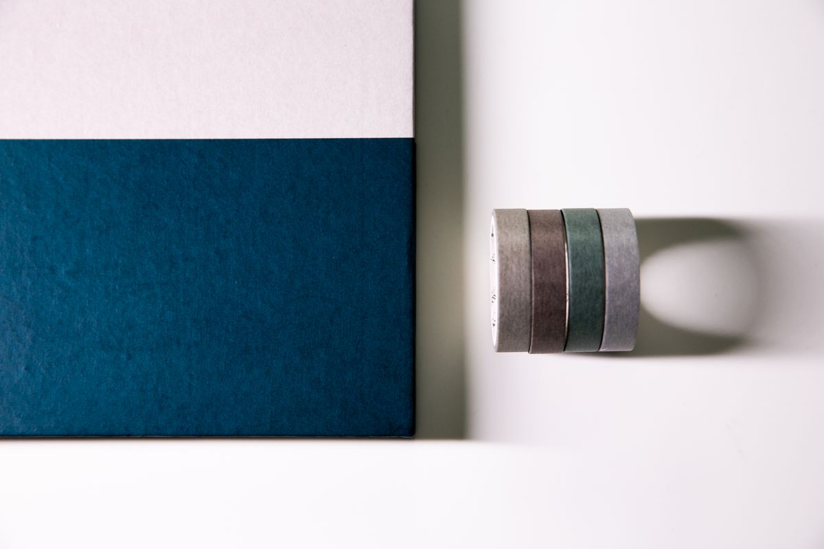 Notebook decorated with tapes, styled like a duct tape book cover project