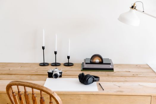 Photo of a Desk with a Camera and Candles