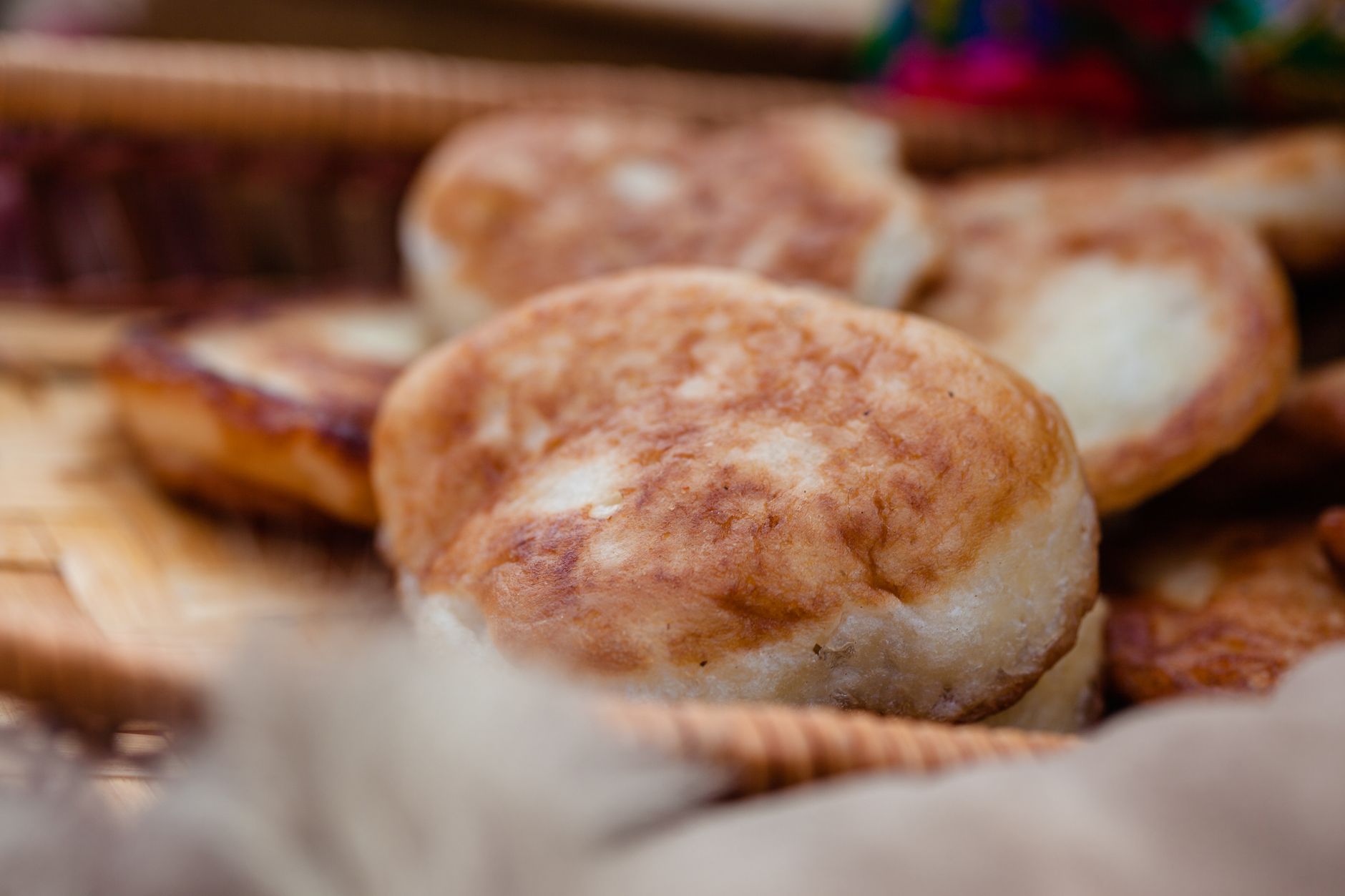 Plate of crispy Johnnycakes served with butter and maple syrup