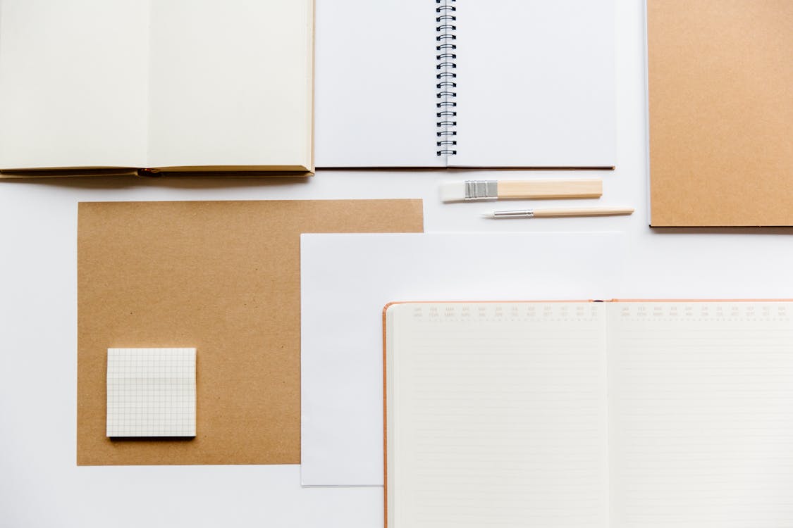 Overhead Shot of Notebooks and Planners · Free Stock Photo