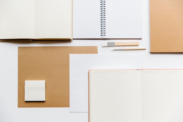 Overhead Shot Of Notebooks And Planners