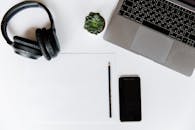 A Black Pencil Beside an Iphone