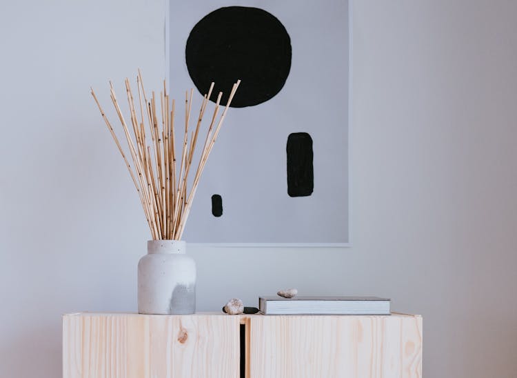 Drawing On Wall And Vase With Sticks