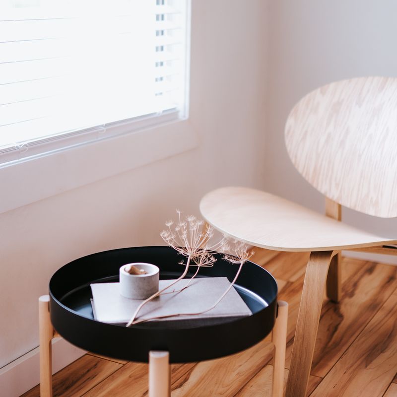 White armchair with a side table