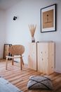 Brown Wooden Cabinet Beside White Wall
