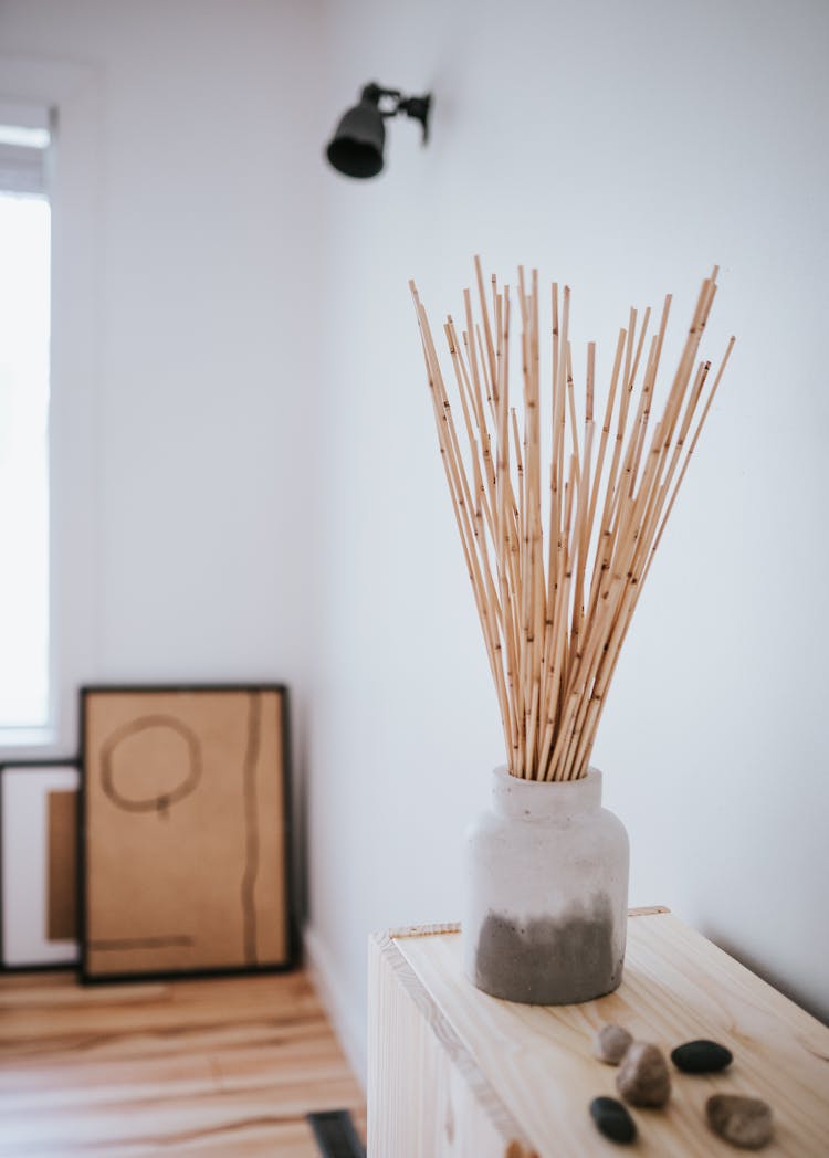 Bamboo Sticks On Gray Concrete Vase 