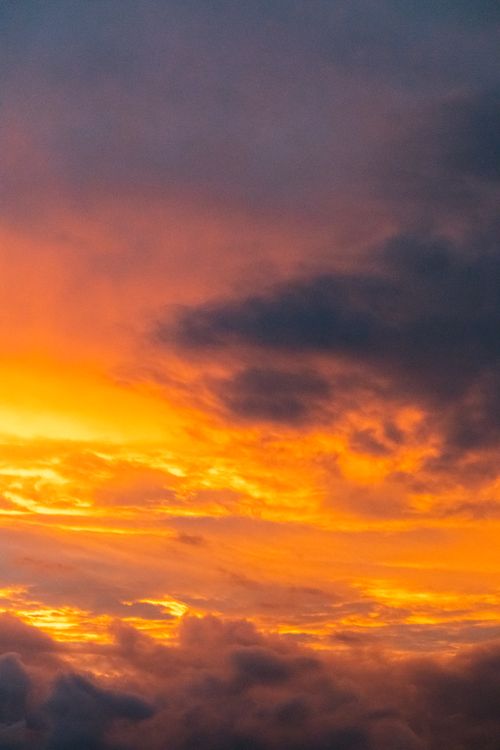 Free A breathtaking view of an orange and purple sunset sky, captured in Volta Redonda, Brazil. Stock Photo
