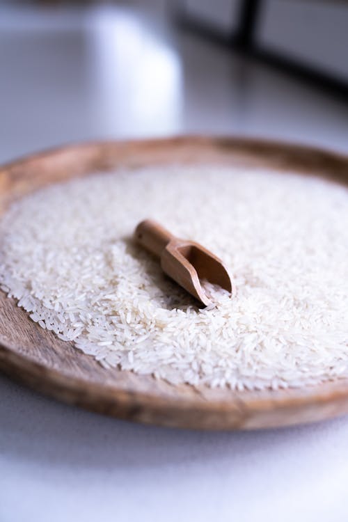 Free White Rice Grains with Brown Wooden Shovel Stock Photo