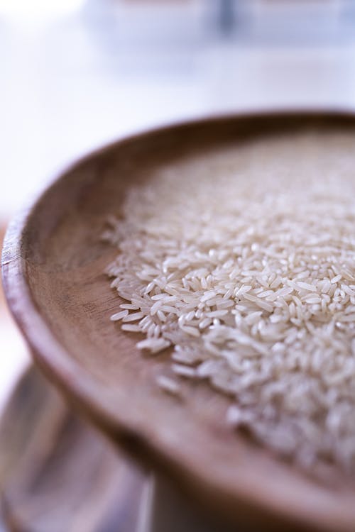 Rice Grains on a Wooden Plate 