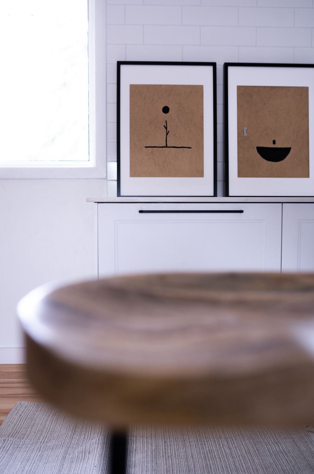 Minimalist decorative art prints displayed on an interior wall