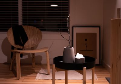 Cozy minimalist interior with a wooden chair and coffee table. Photo by PNW Production on Pexels