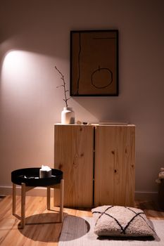 Modern interior design featuring minimalist wood furniture, soft lighting, and artistic decor.