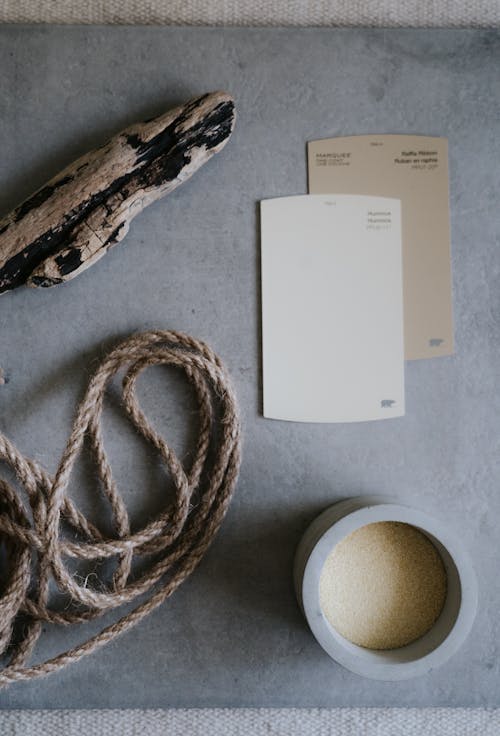 A Rope Besides Cardboards over a Gray Board