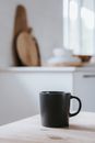 A Close-Up Shot of a Ceramic Cup on a Wooden Table