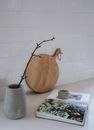 A  Gray Vase Beside the Book