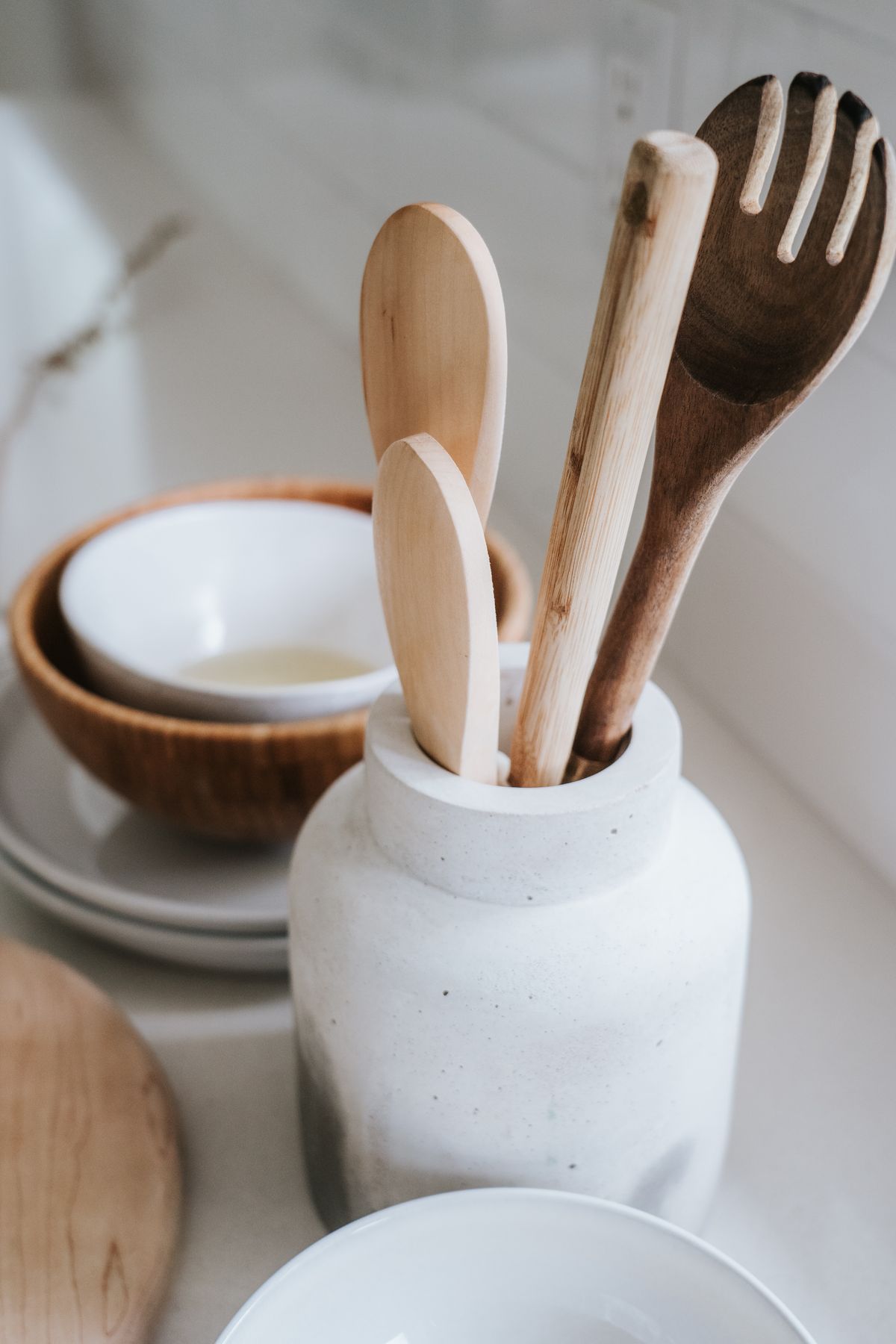 Wooden cooking utensils arranged on a clean kitchen countertop
