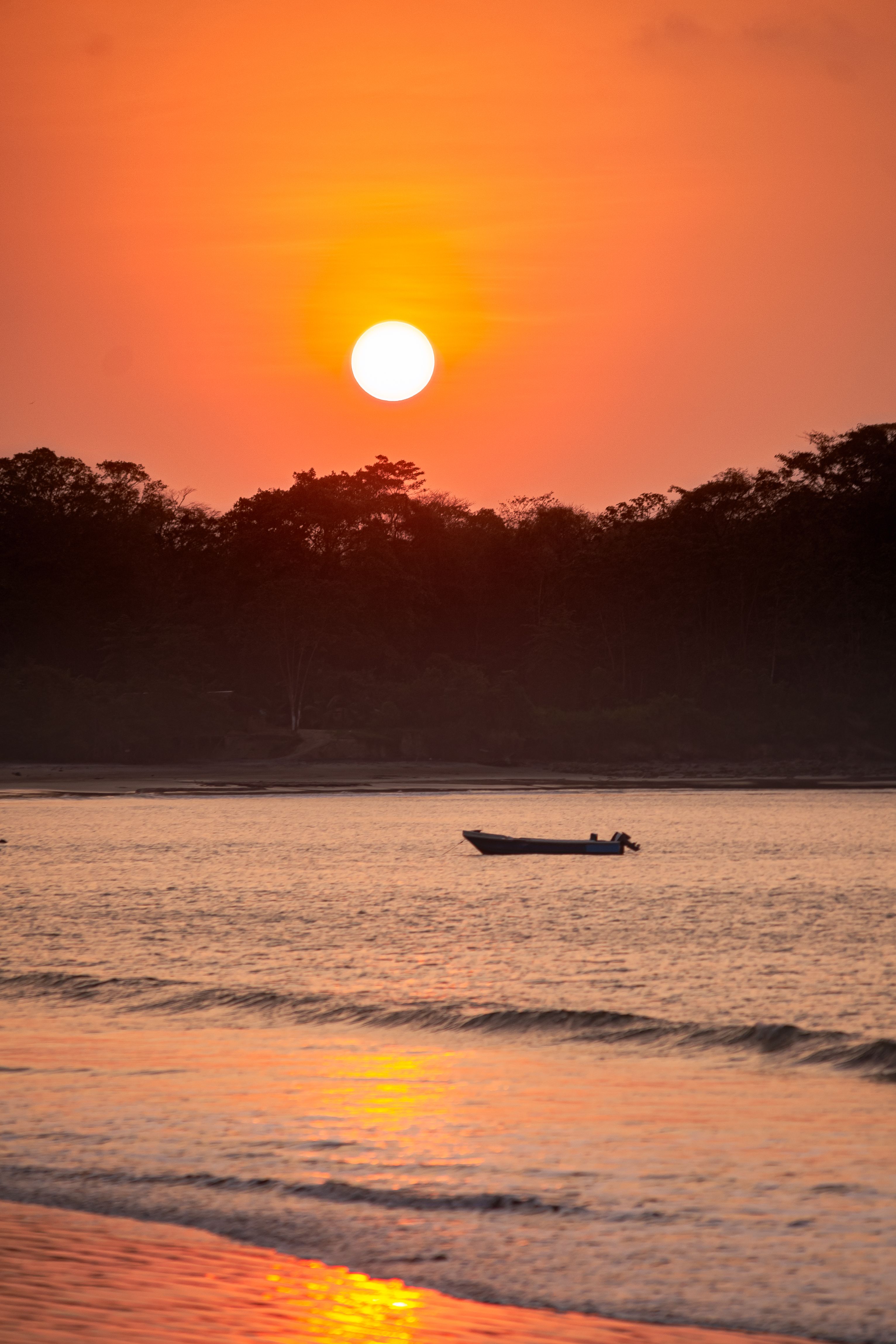 Silhouette of Boat on the Sea during Golden Hour · Free Stock Photo