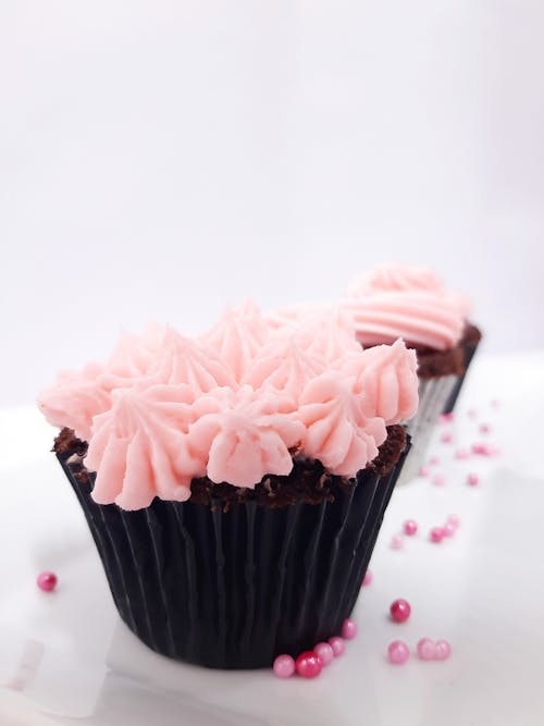 A Chocolate Cupcake with Pink Icing