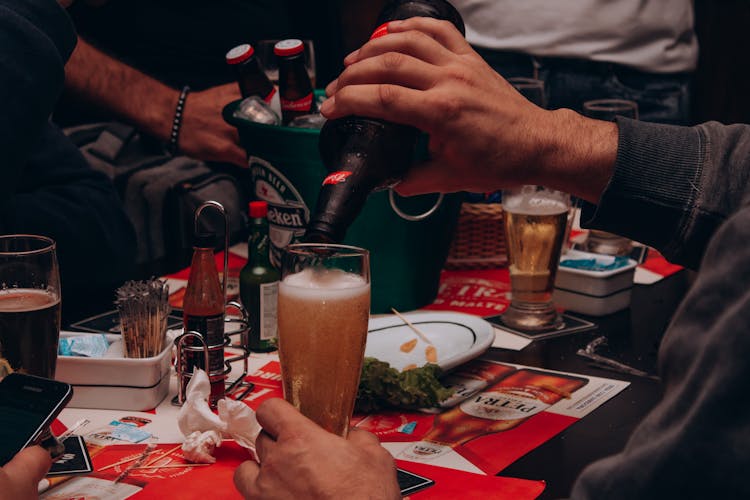 Man Pouring Beer Into Glass