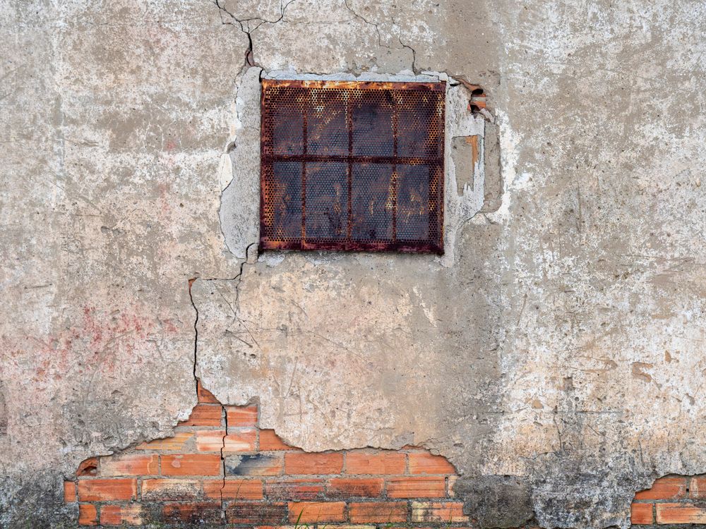 Black Metal Window on a Chipping Wall · Free Stock Photo