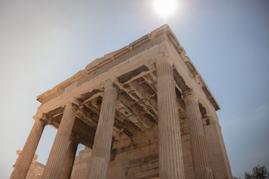 Iconic view of the Parthenon columns in Athens under a bright sky.