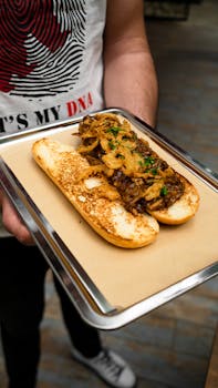 Savor this appetizing open-faced roast beef sandwich with crispy onions, served on a tray.