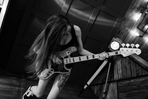 A Woman Playing an Electric Guitar