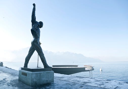 Iconic Freddie Mercury statue on Lake Geneva in Montreux, captured in a serene and foggy morning.