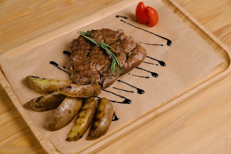 Photo Of A Grilled Steak And Potato Wedges