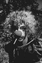 Grayscale Photo of Woman With Curly Hair