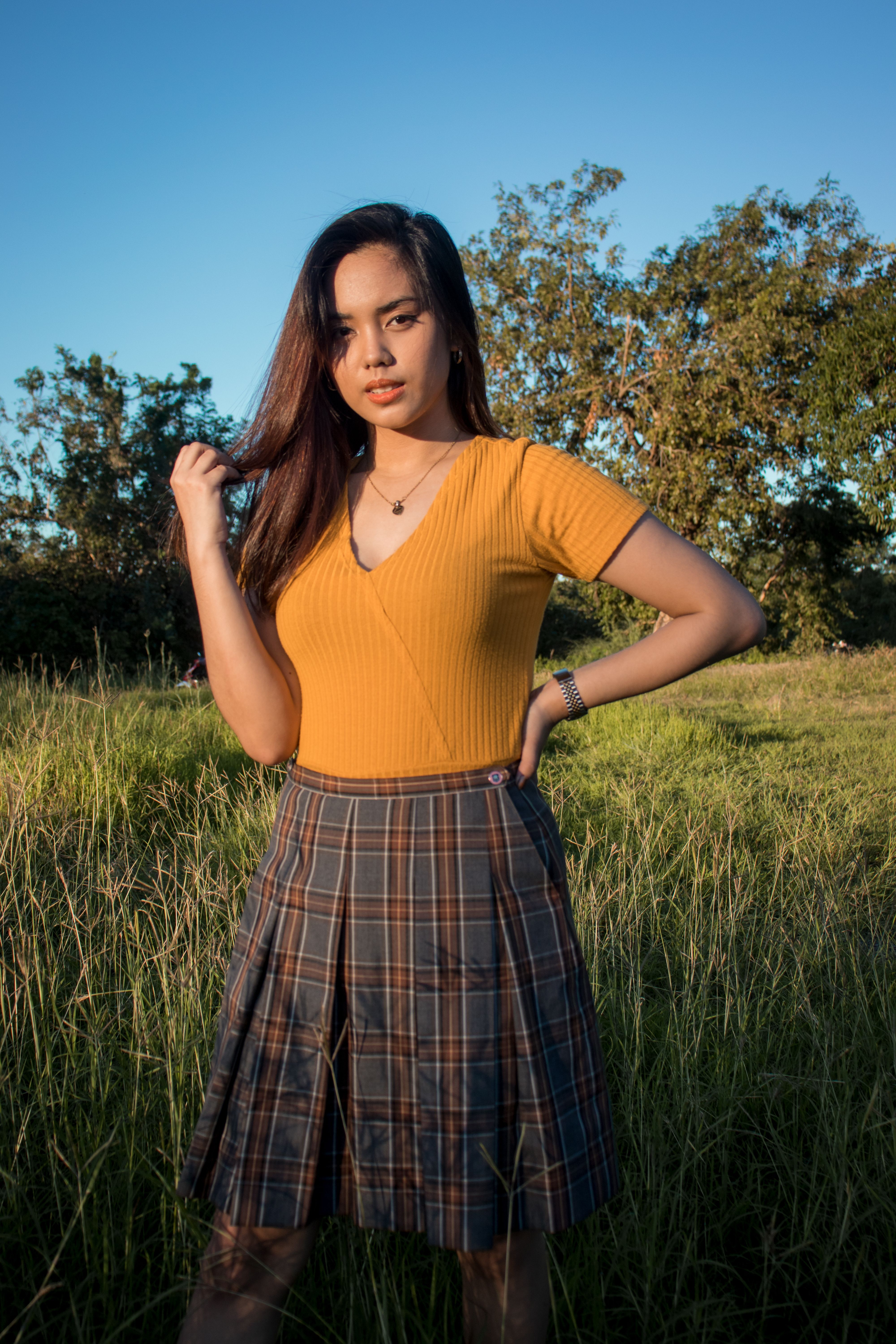 A Woman in Yellow Tank Top and Mini Skirt · Free Stock Photo