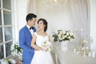 Man in Blue Suit and Woman in White Wedding Dress