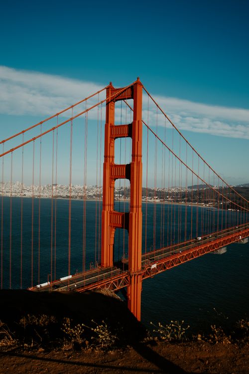 Free Vertical view of the iconic Golden Gate Bridge against a clear blue sky in San Francisco. Stock Photo